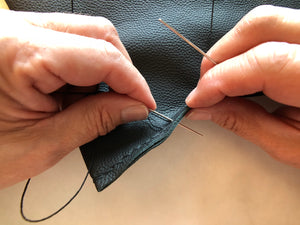 Soluna Studio Hand Stitching a new Leather Laptop Sleeve